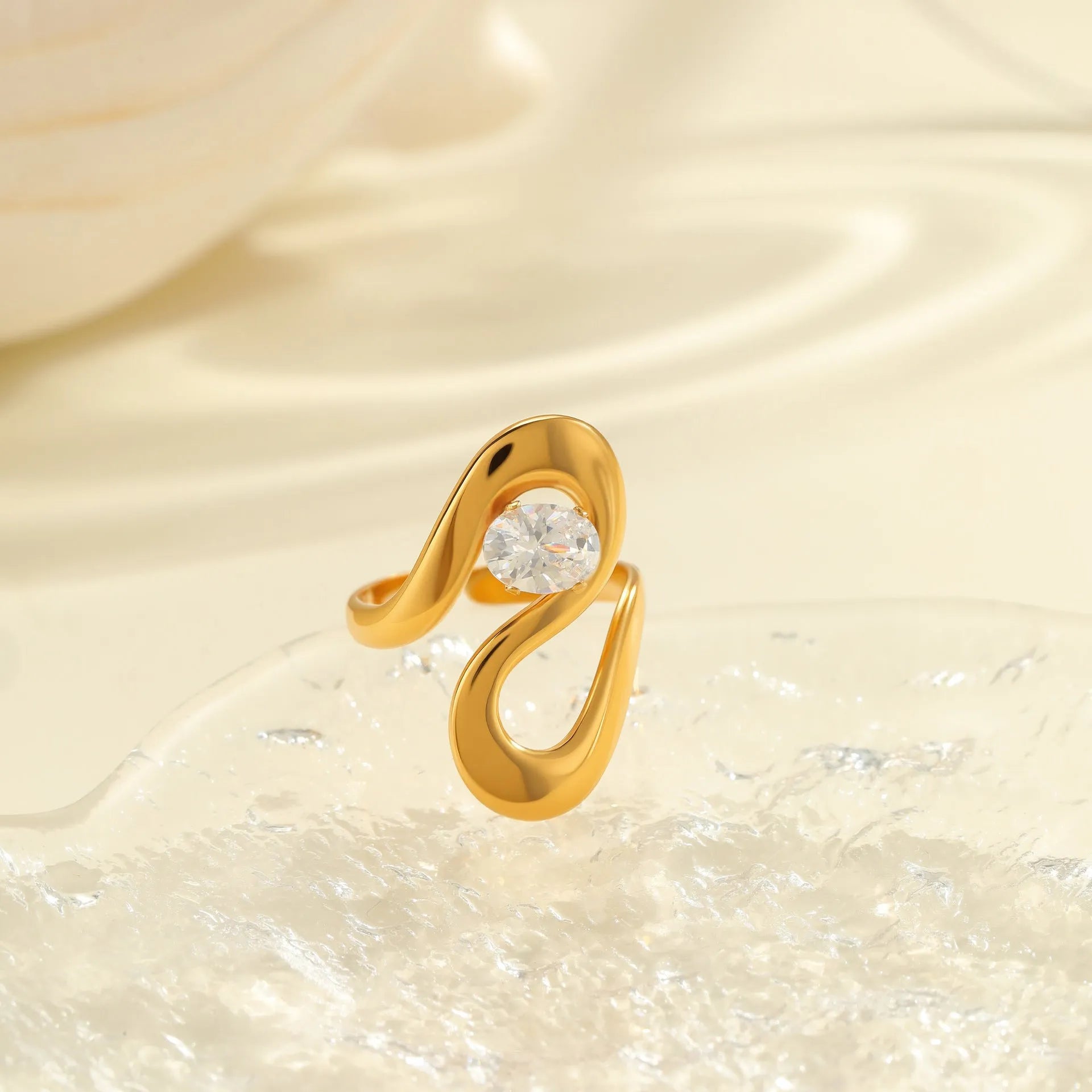 Open mouth geometric zircon ring with round, oval and quadrangle elements on stainless steel band