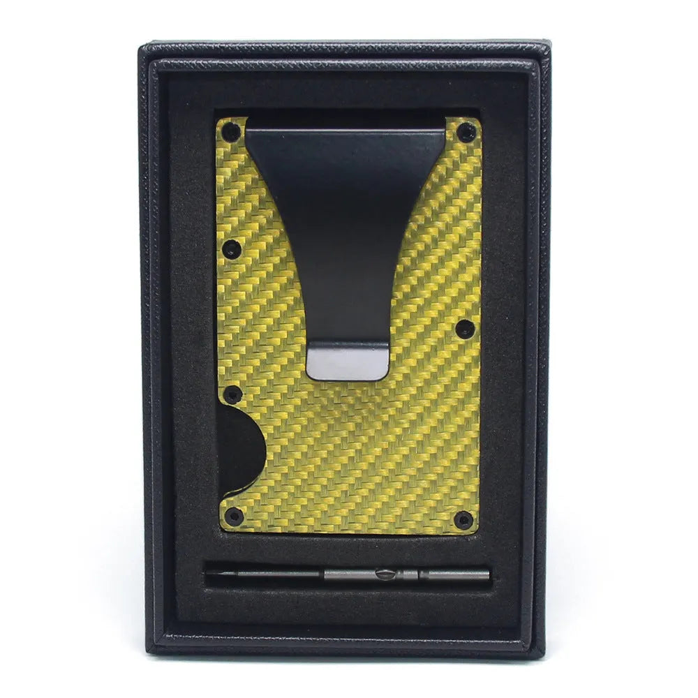 Geometrical black carbon fibre card wallet for business cards and banknotes on a gift box.