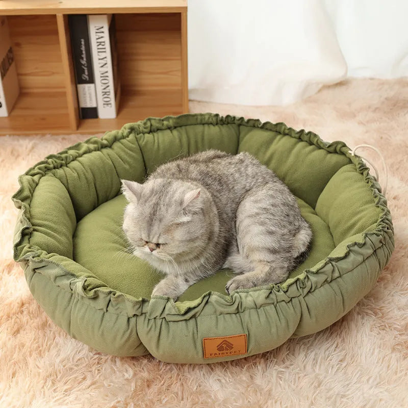 Grey and green reversible donut-shaped cat bed for indoor cats and small dogs