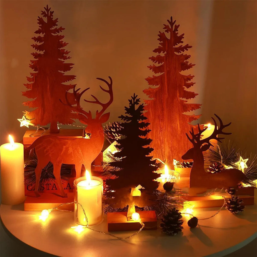 Set of three rusty metal Christmas tree decorations with elk silhouettes on a rustic surface.