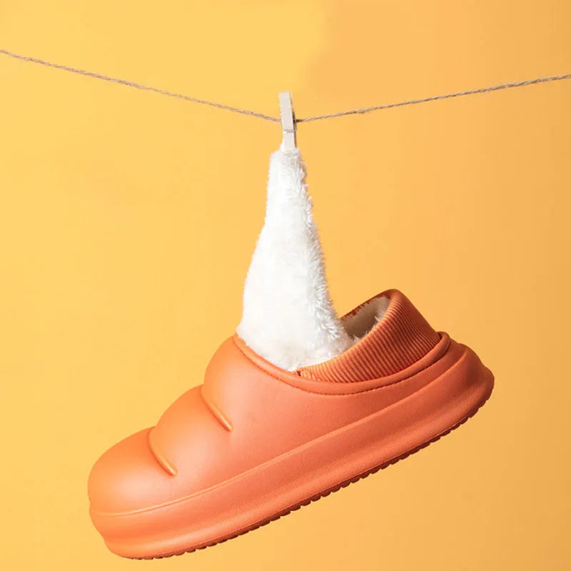 Waterproof EVA couple slippers in various colours showing hollow design and flat non-slip sole.