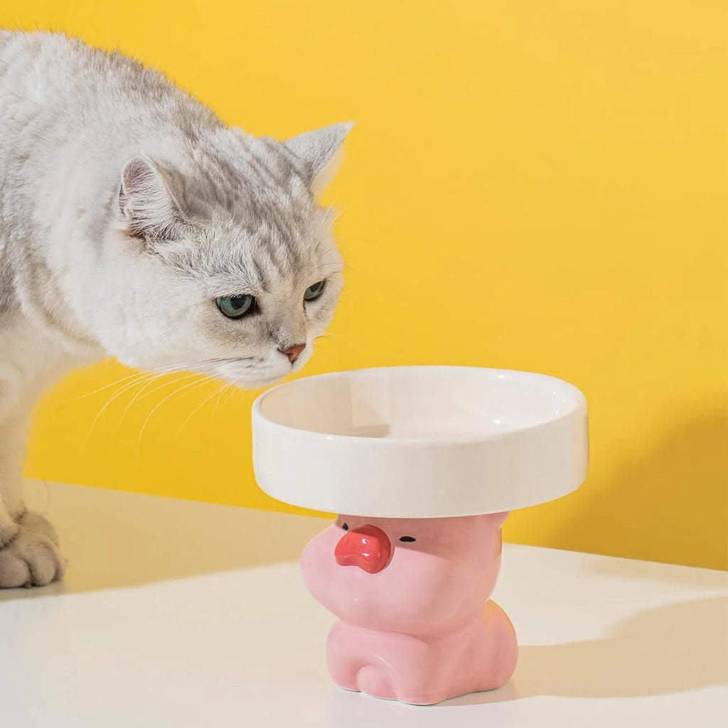 Ceramic raised cat bowl in animal theme design on white background