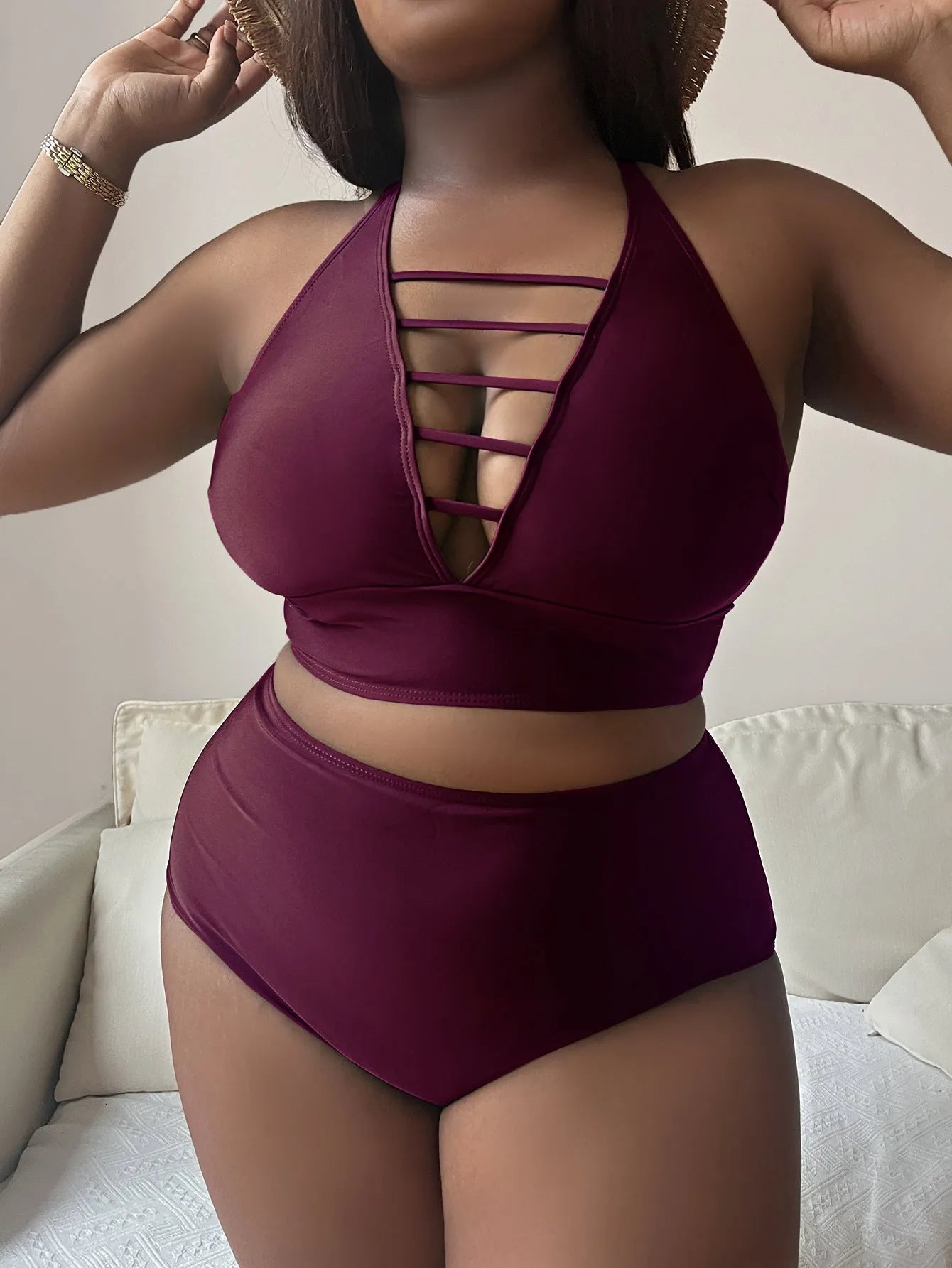 Plus size woman modelling a black adjustable halter bikini with high waist briefs