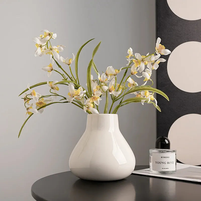 Ceramic decorative vase with artificial orchid flowers in black or white colour options