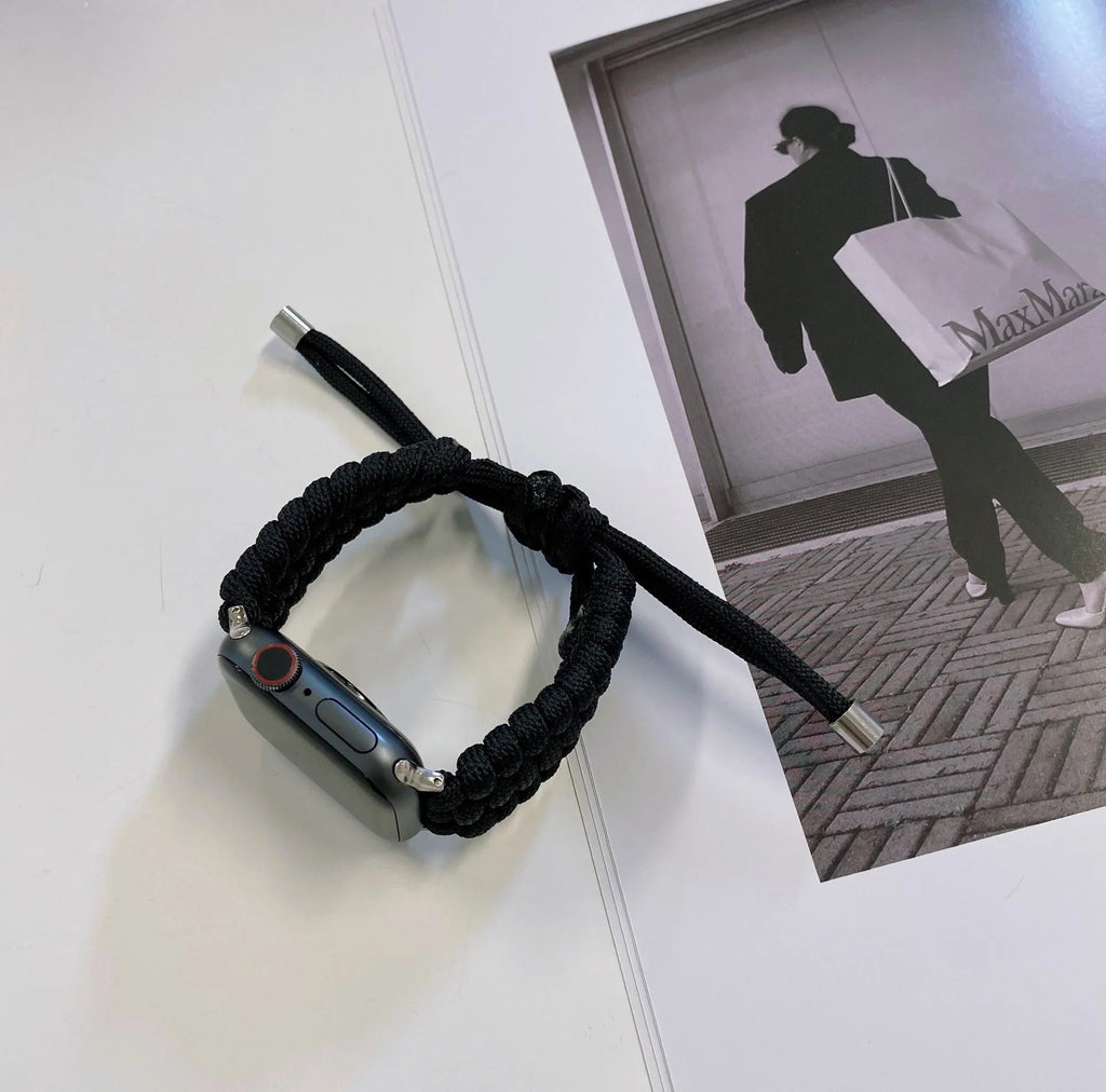 Braided black paracord smart watch strap with raw ear connector for Apple, Samsung, Huawei watches.