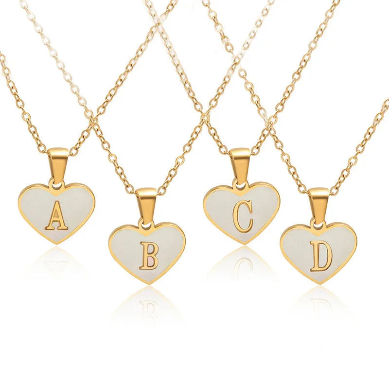 Gold plated heart necklace with white shell centre on a 45+5cm chain