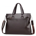 Men's black PU leather business messenger bag with shoulder strap showing spliced panel design.