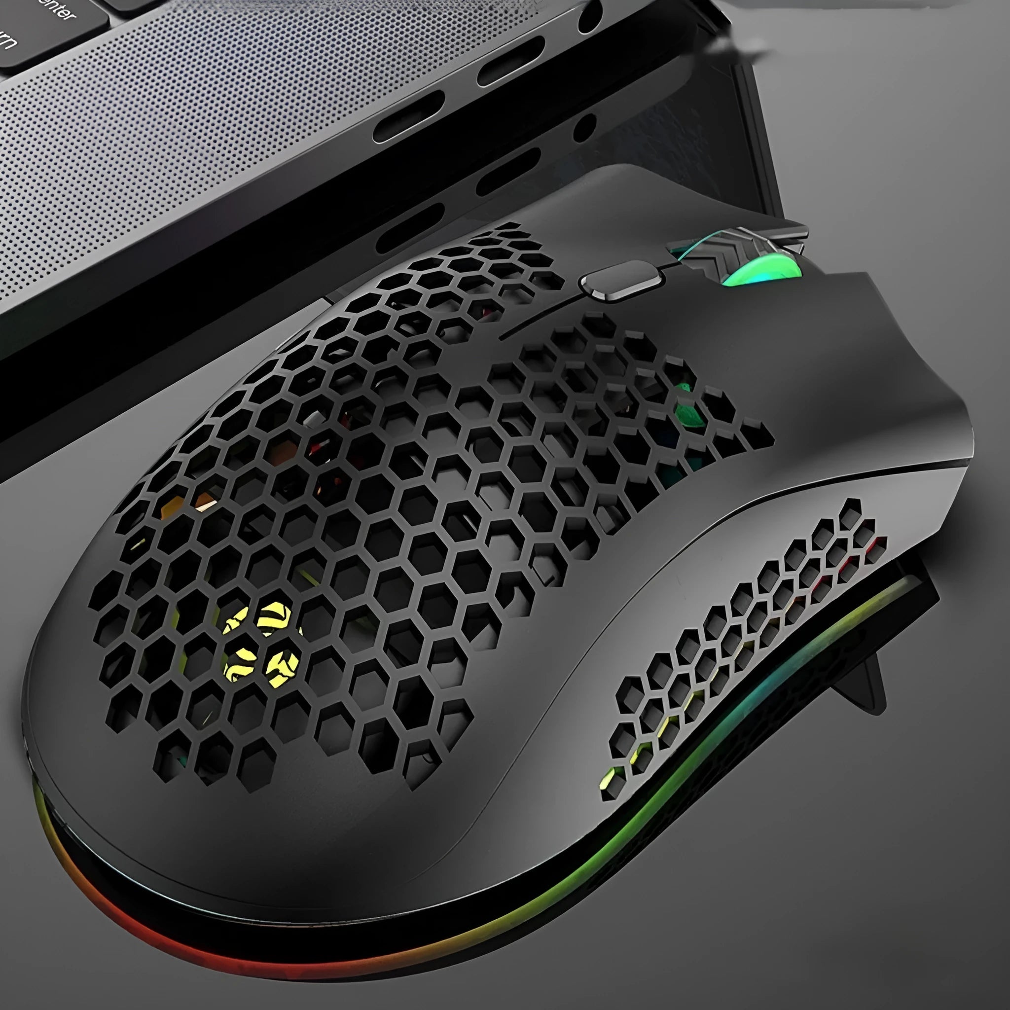 Wireless gaming mouse with hollow-out illuminated design in cyan colour showing ergonomic shape