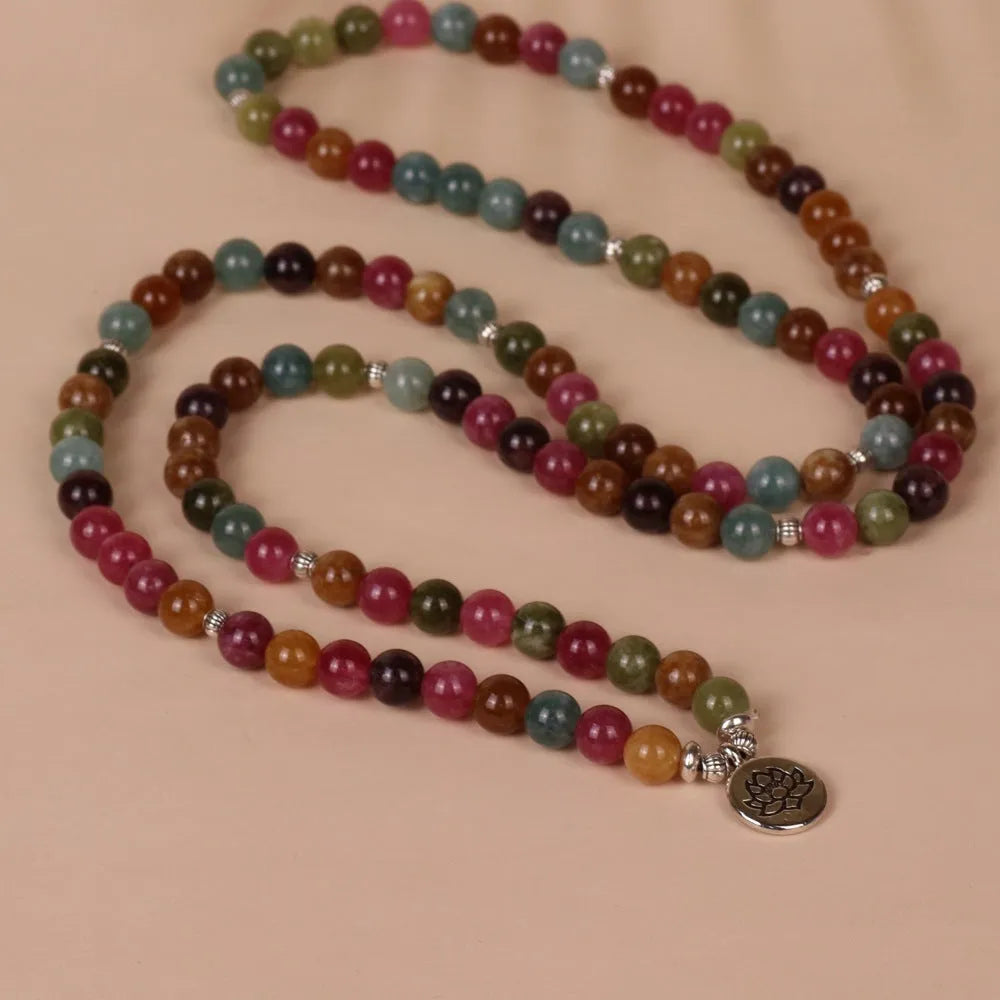 108-bead lotus hanging multi-layer bracelet in tourmaline colour on wrist