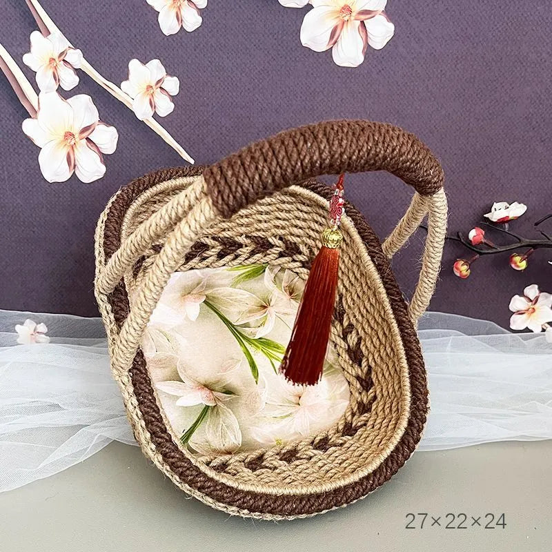 Round hand-woven hemp rope basket in a natural colour with a flat base.