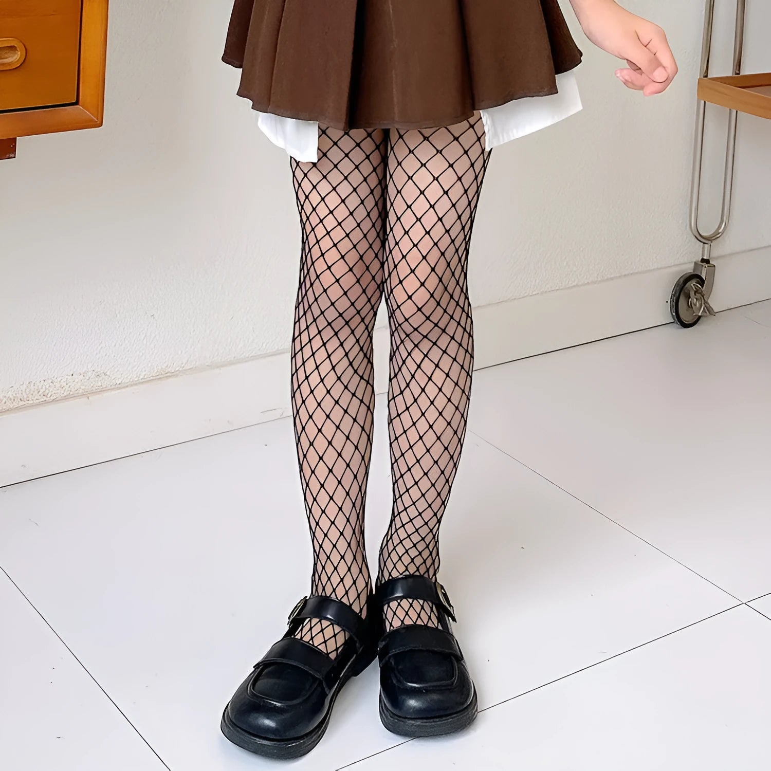 Women's black and white mesh stockings in large, medium, and small net patterns.
