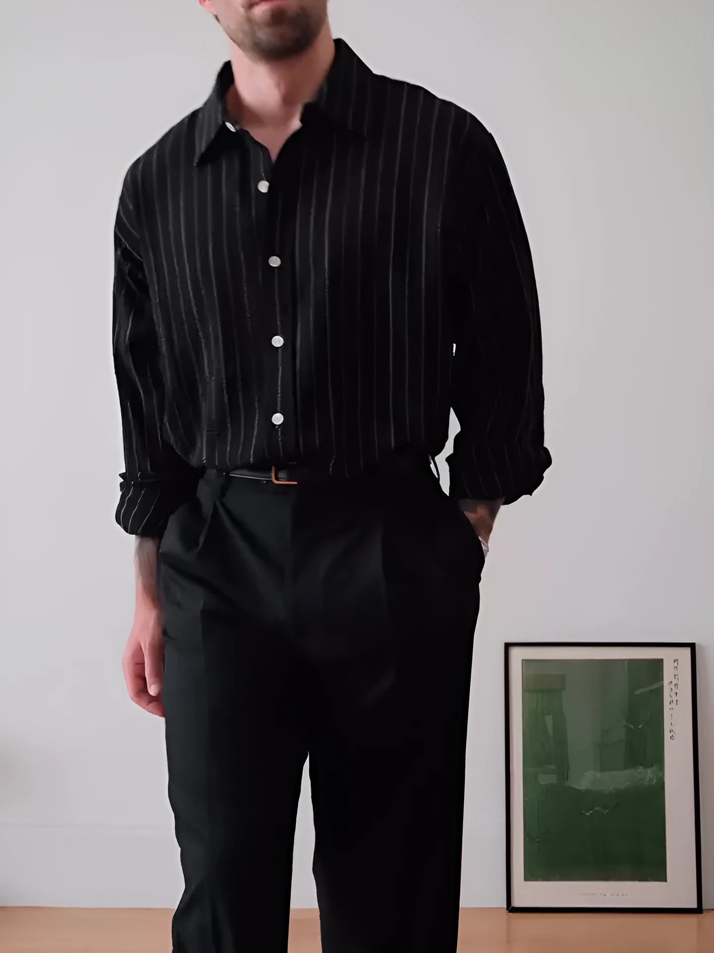 Man's black and white pinstriped long sleeve formal button-down shirt