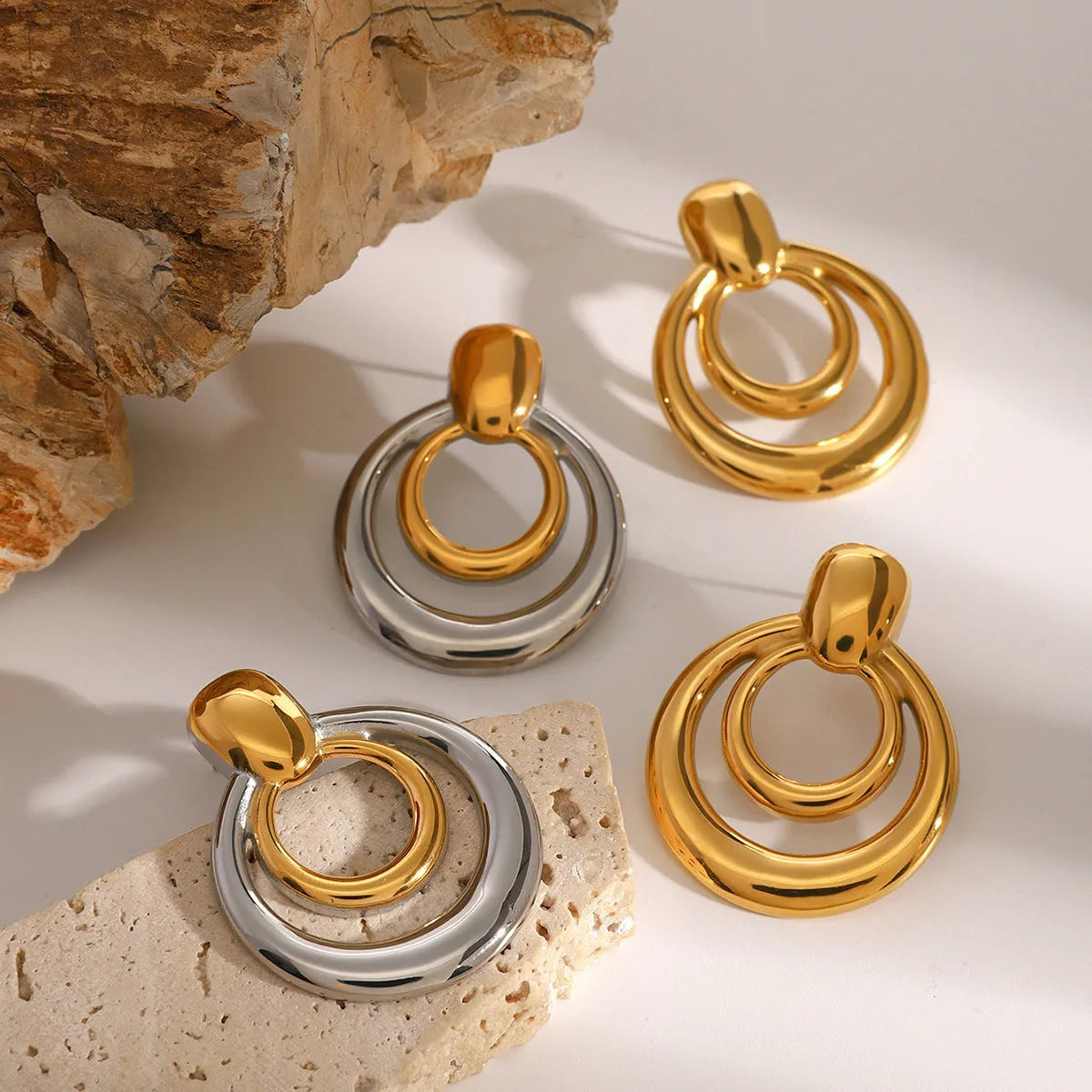 18K gold plated double layer hollow stud earrings with round geometric shape on titanium steel