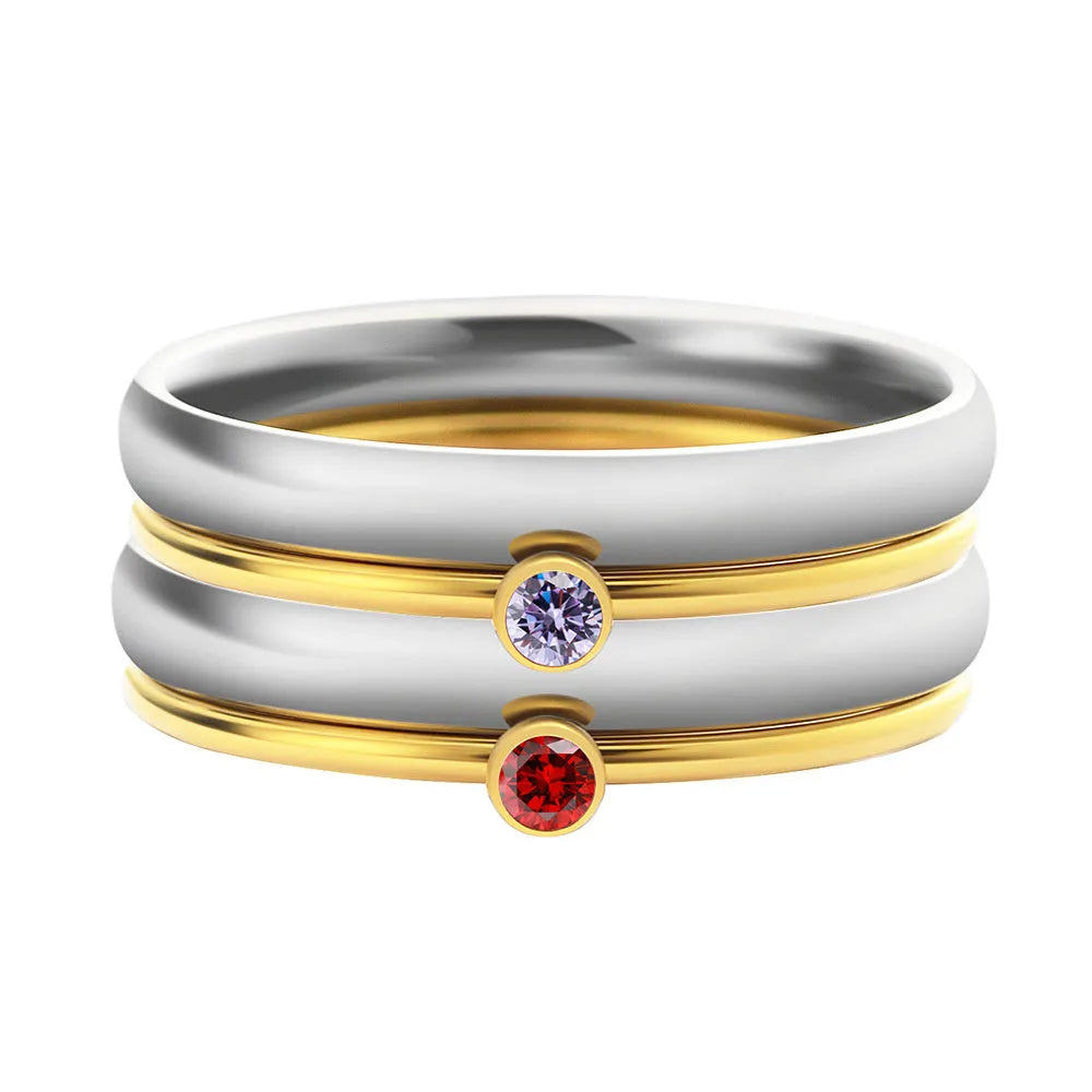 Geometric titanium steel ring with December colour birthstone and superimposed engraving.