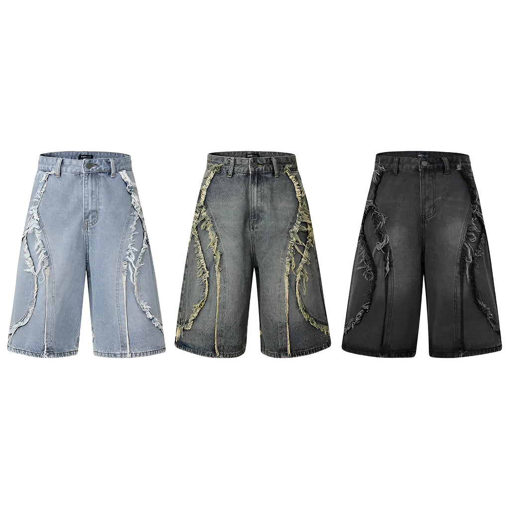 Straight cut denim shorts with raw edge distressing in black, shown on a model.