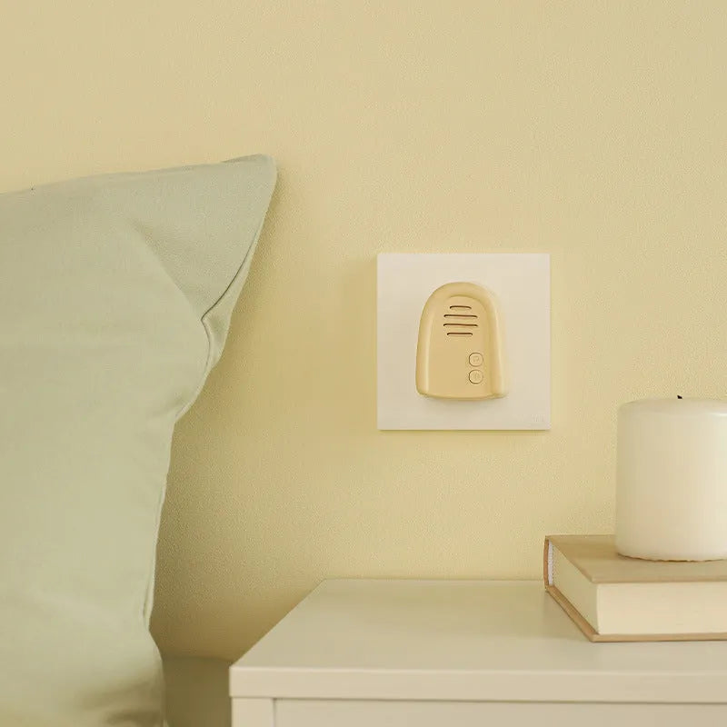 Plug-in wireless beeper doorbell in milky yellow or white colour for household use