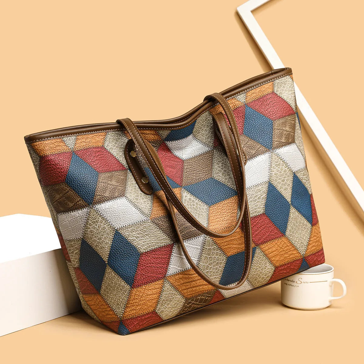 Women's large capacity PVC handbag in blue brown colour with sandwich pocket design and shoulder strap