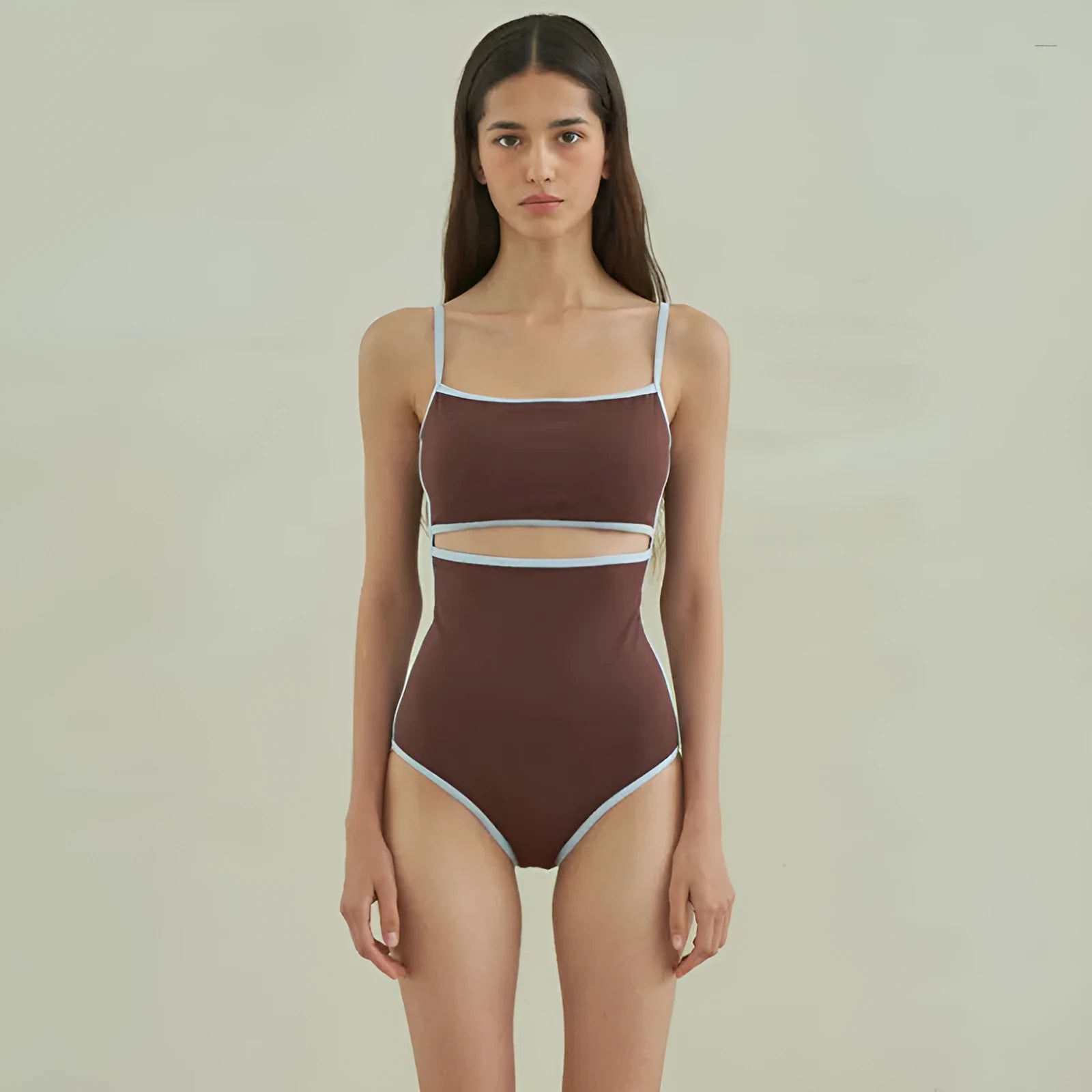 Brown women's triangle one-piece swimsuit on a hanger, sizes M L XL available.
