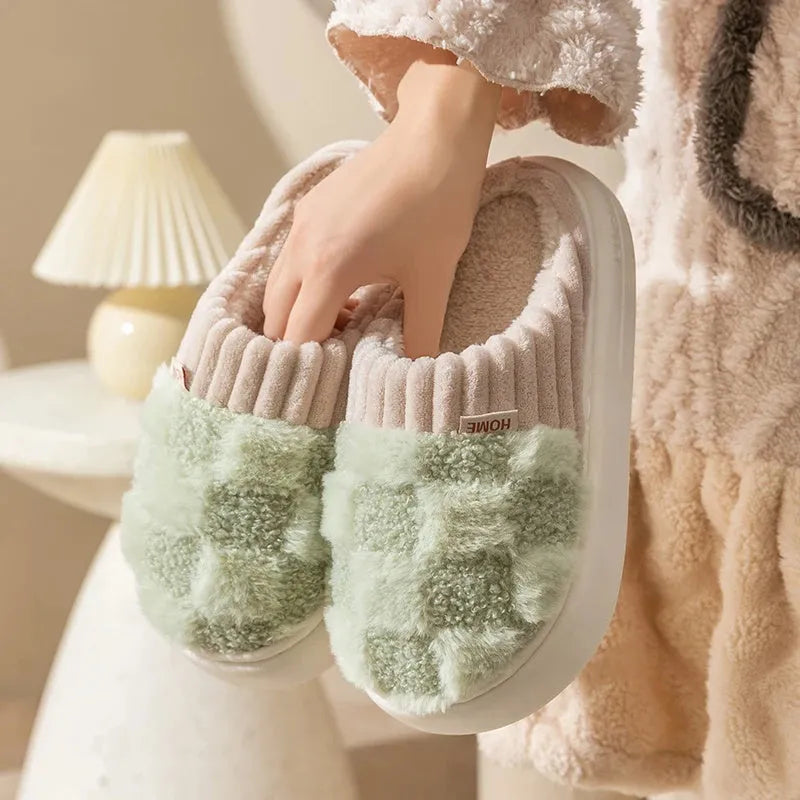 Plaid patterned women's indoor slippers in various colours with a soft sole and plush interior.