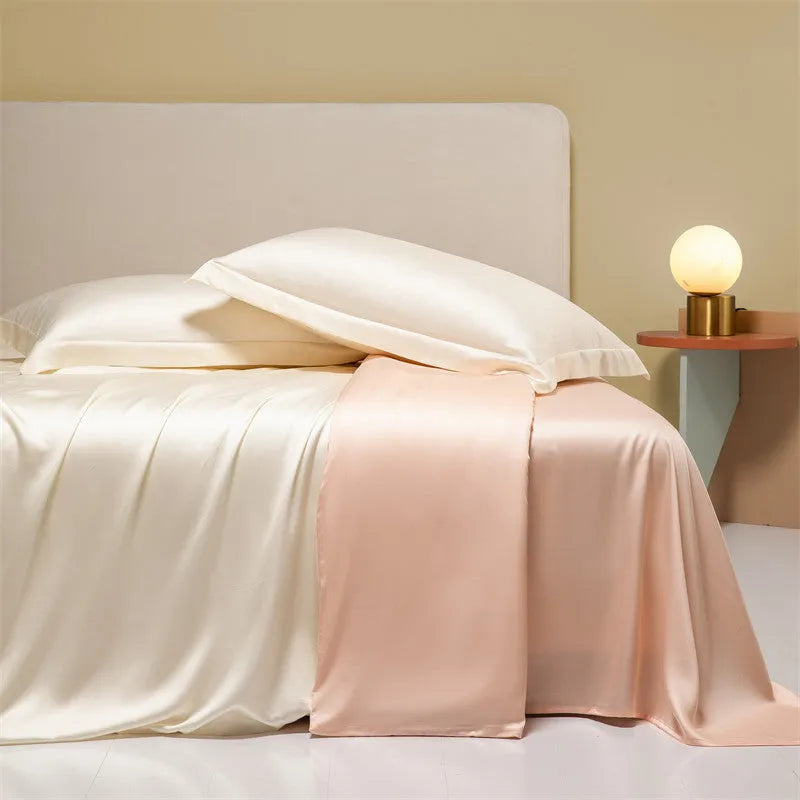 Solid colour Tencel Lyocell bed linen set with quilt cover and pillowcases on a bed.