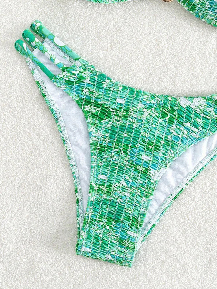 Women's high-waisted floral bikini swimsuit in blue, orange, pink, or rose red on a mannequin