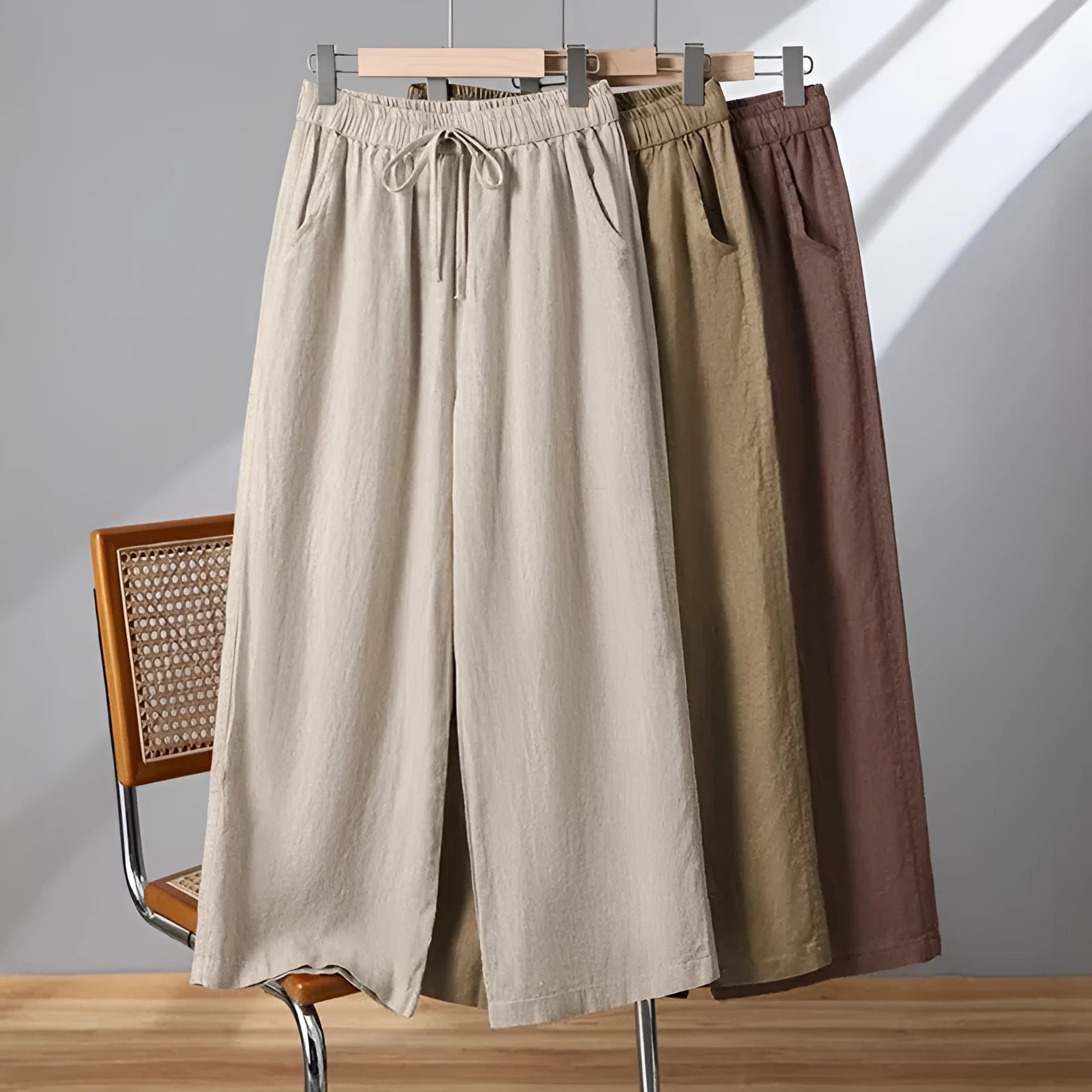 Women's apricot straight-leg casual trousers with elastic waist and lace-up detail.