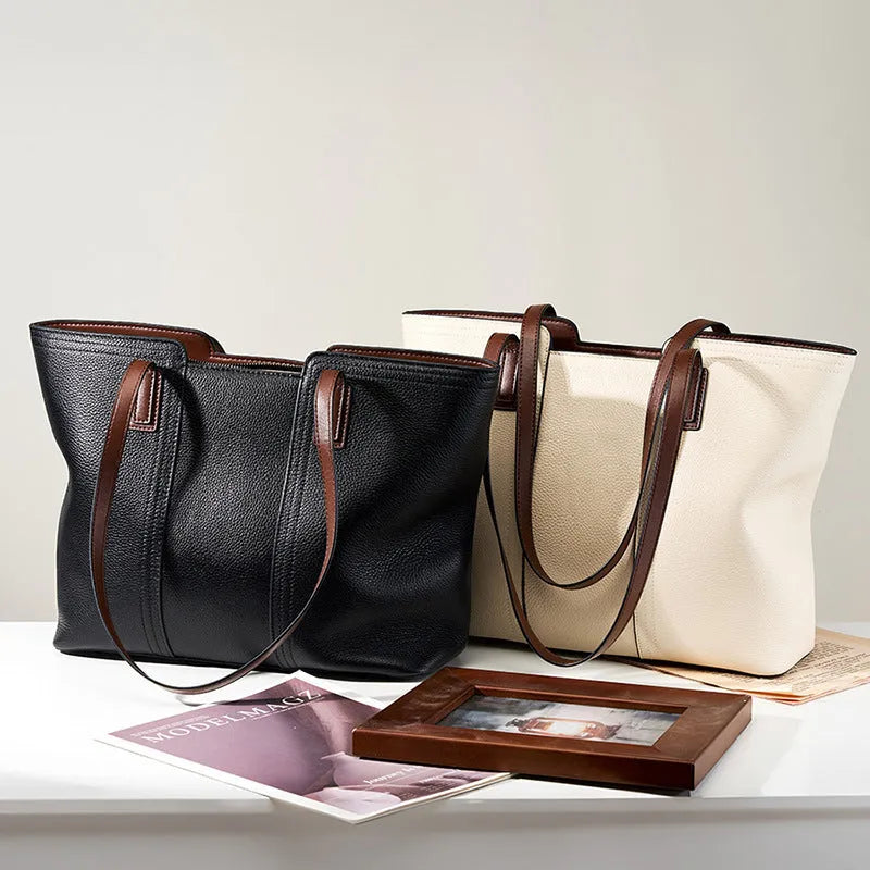 Women's black genuine leather crossbody shoulder bag with horizontal square shape and multiple internal compartments