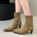 Brown women's square toe ankle boots with a side zip and mid kitten heel on a waterproof platform sole.