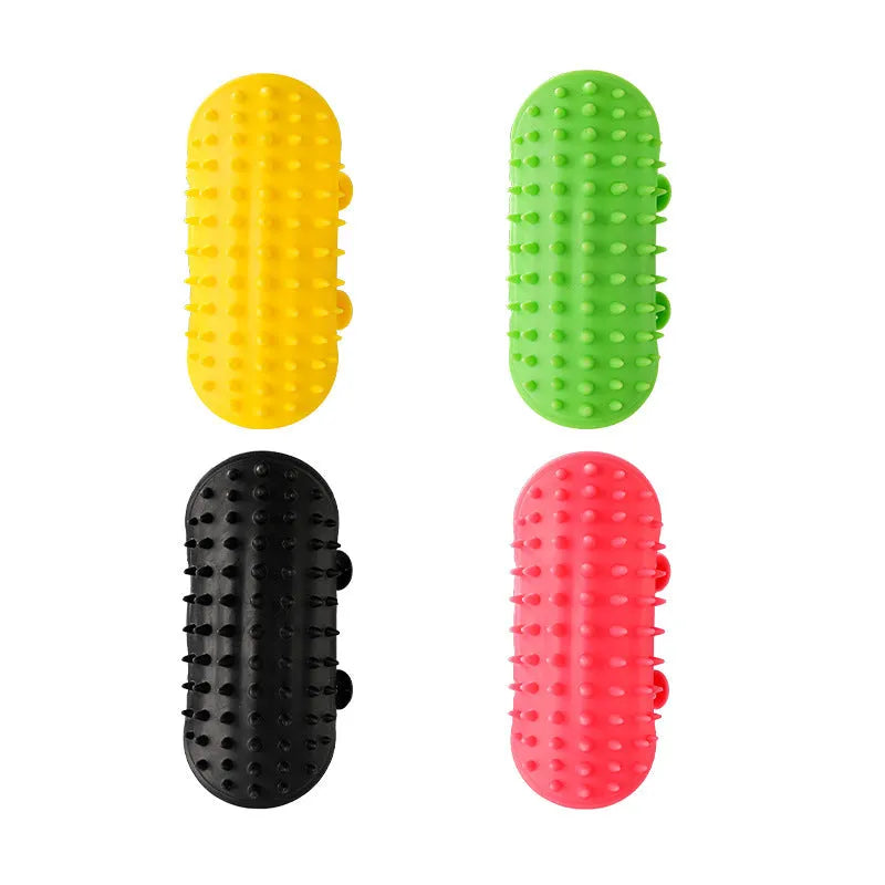 Silicone cat grooming comb with adjustable strap mounted on table leg, showing rounded teeth for pet hair removal