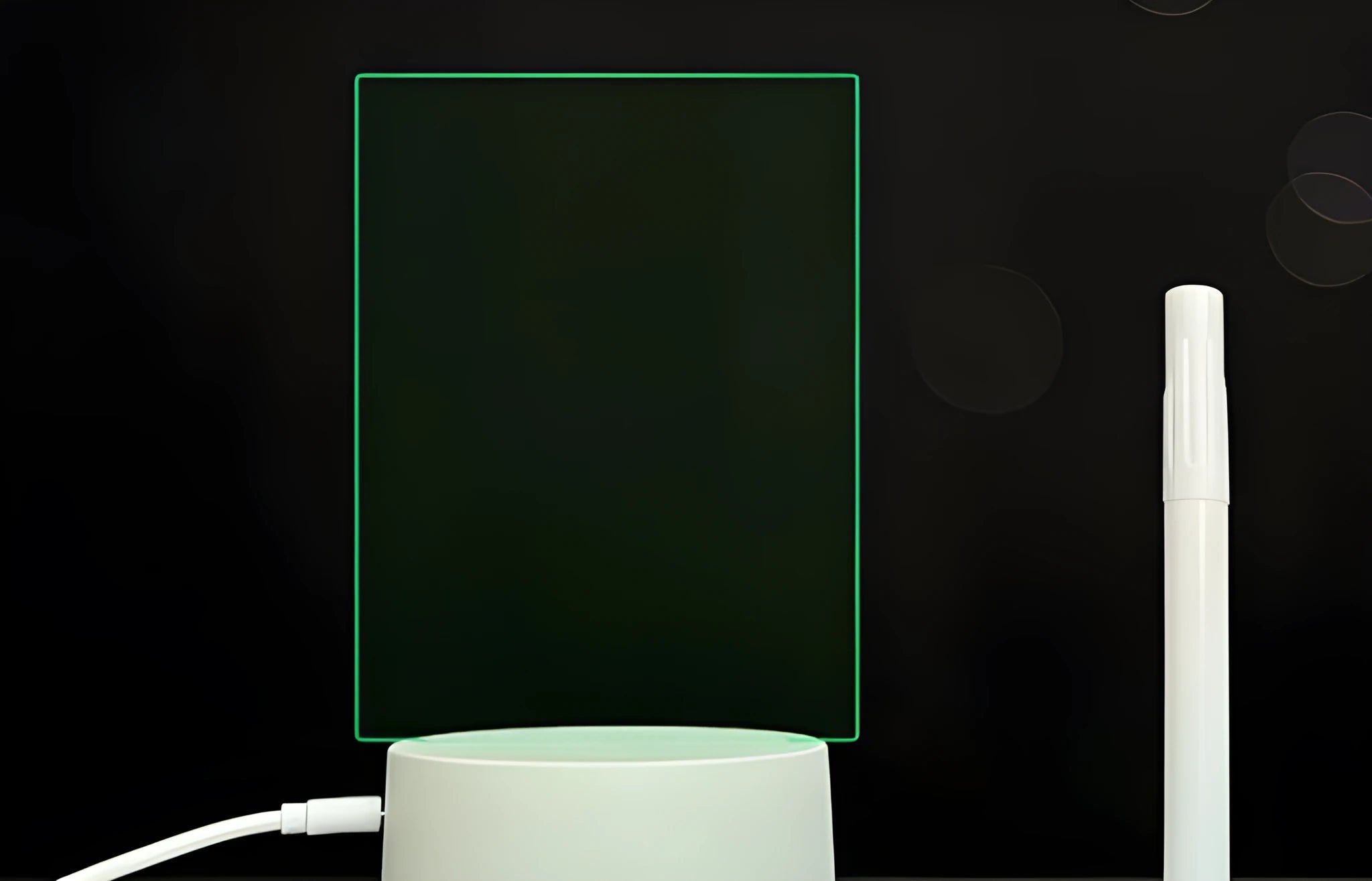 3D acrylic message board LED lamp lit up on a desk with remote control and marker pen.
