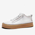 Men's black leather casual shoes with round toe, flat heel, and white laces on a rubber sole.