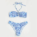 Women's blue floral bandeau bikini swimsuit with split style design on mannequin