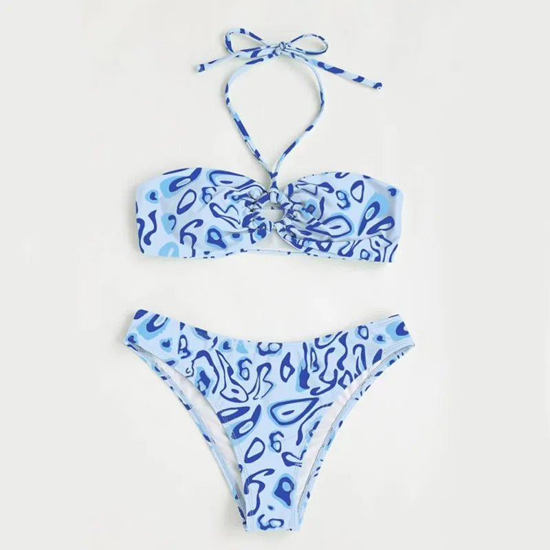 Women's blue floral bandeau bikini swimsuit with split style design on mannequin