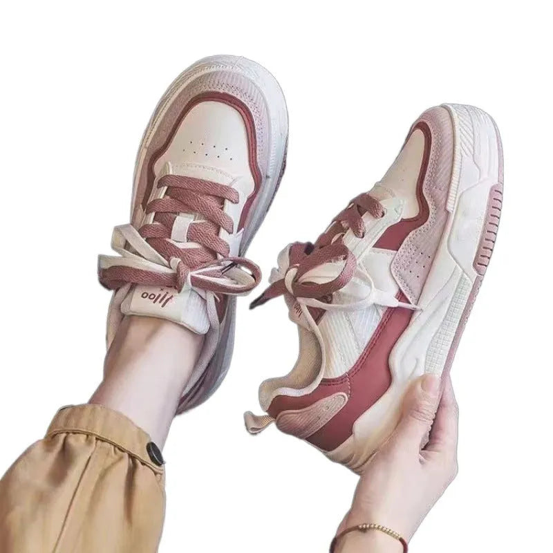 Low-top sneakers with rubber soles in beige and pink colour options showing height-increasing design