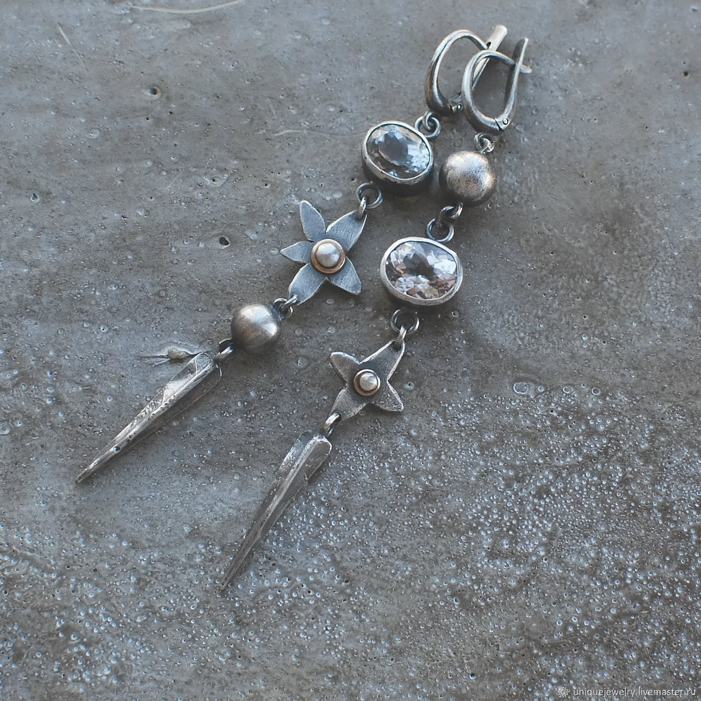 Geometric antique silver earrings with rhinestone accents and XINGX pendant design