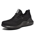 Low-cut black safety work shoes with a steel toe cap and EVA midsole on a grey background.