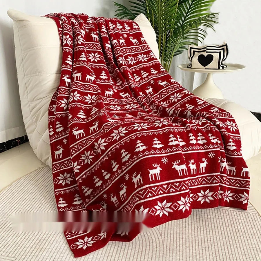 Personalised acrylic Christmas blanket with cartoon reindeer or snowflake pattern on sofa