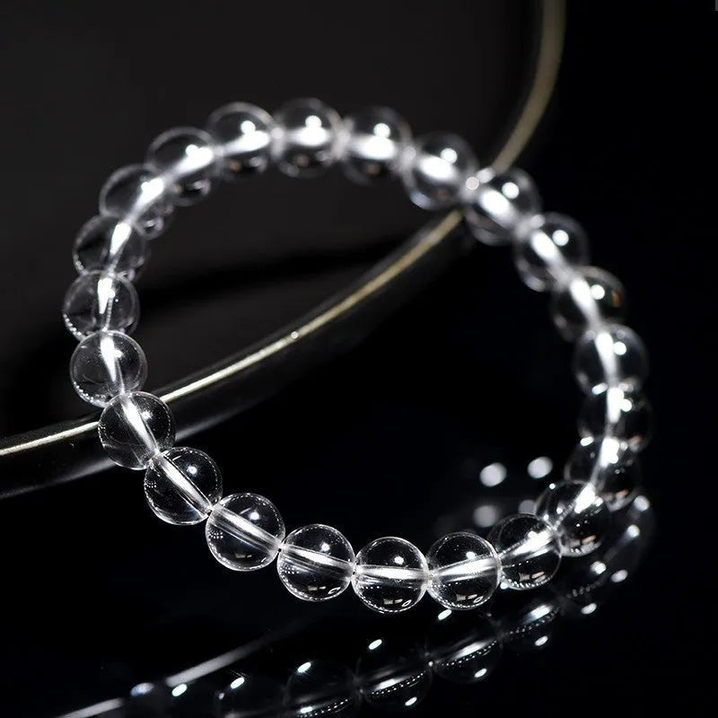 Natural Donghai Old Mine white crystal round bead bracelet on a wrist, showing geometric single strand design.