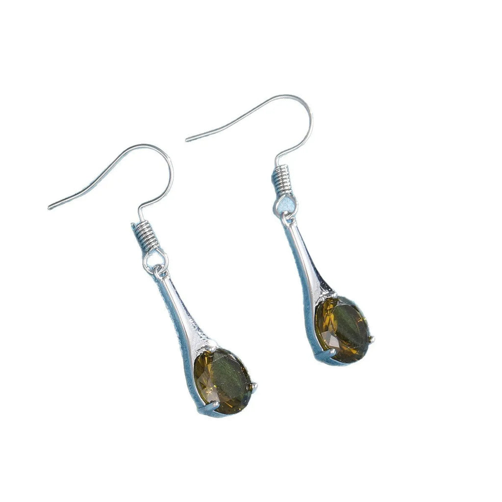 Olive green topaz coloured drop-shaped retro earrings for women on a plain background.