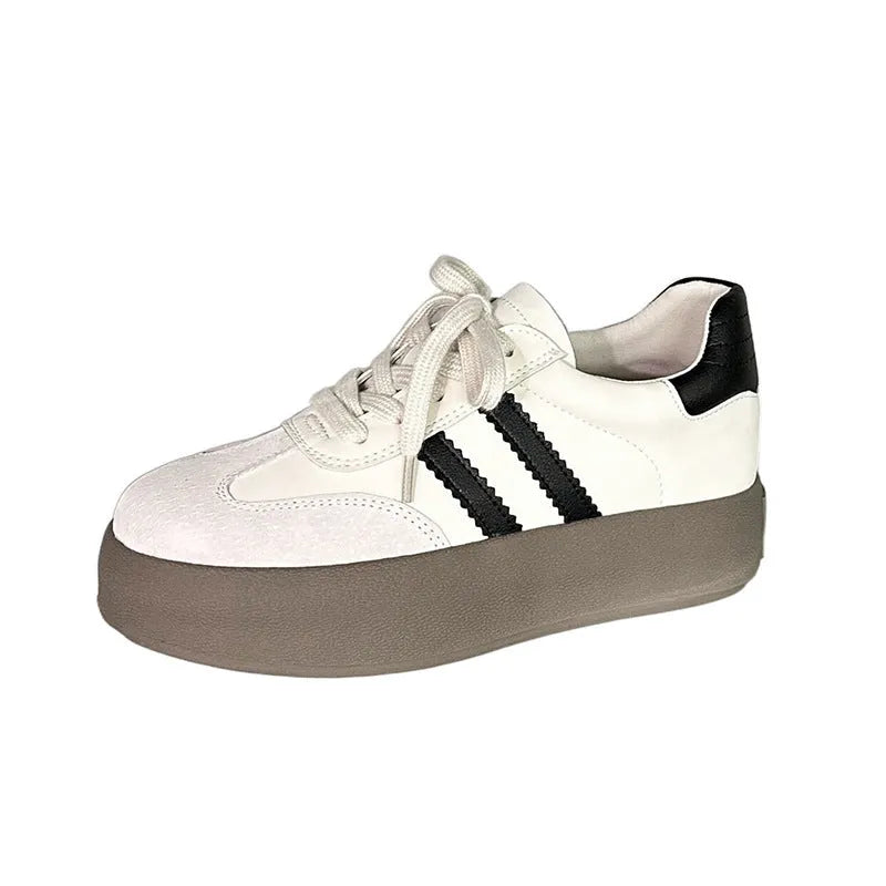 Women's vintage distressed leather sneakers with round toe and lace-up front closure