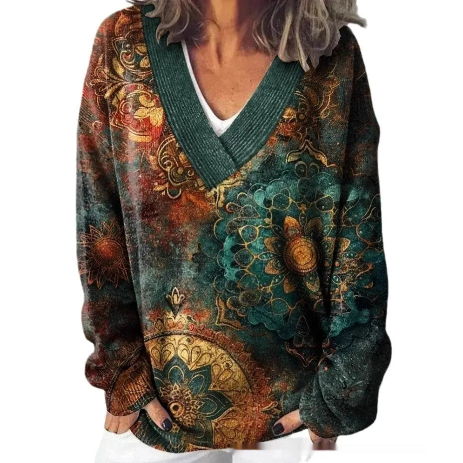 Women's V-neck sweatshirt with a white background and a textured 3D floral printed pattern.