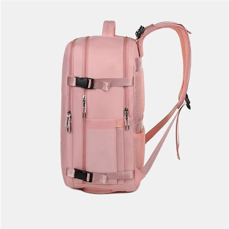 Large purple travel backpack for women with laptop compartment and organisational pockets.