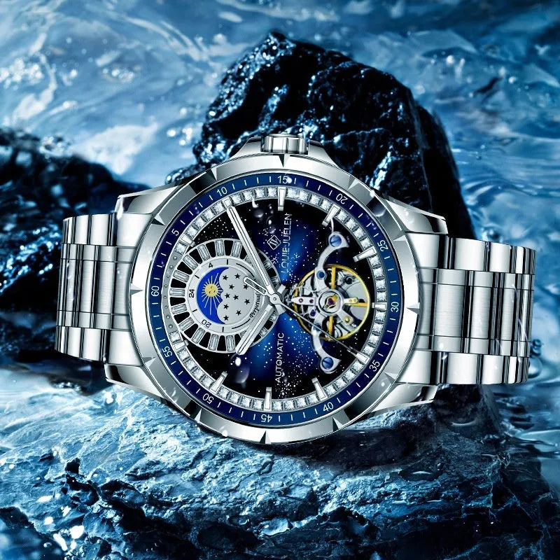 Men's silver alloy automatic watch with a blue circular dial on a stainless steel bracelet with a butterfly clasp.