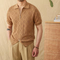 Front view of a white cotton cardigan with a zipper and lapel collar.