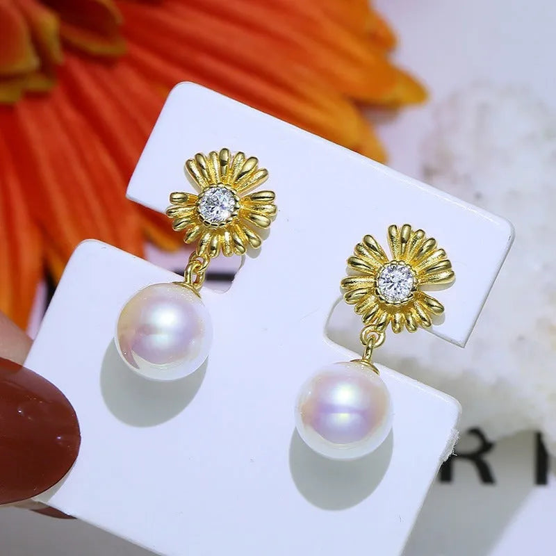 S925 sterling silver baroque flower design earrings and ring holder on a table.