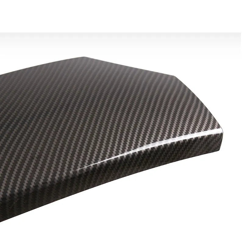 Three ABS carbon fibre pattern armrest box protective covers showing buckle attachment points