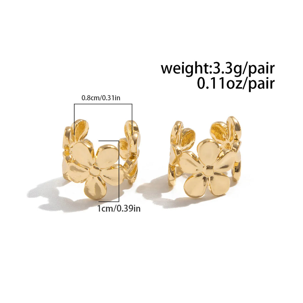 Gold starfish and conch shell earrings with electroplated finish and detailed coastal designs