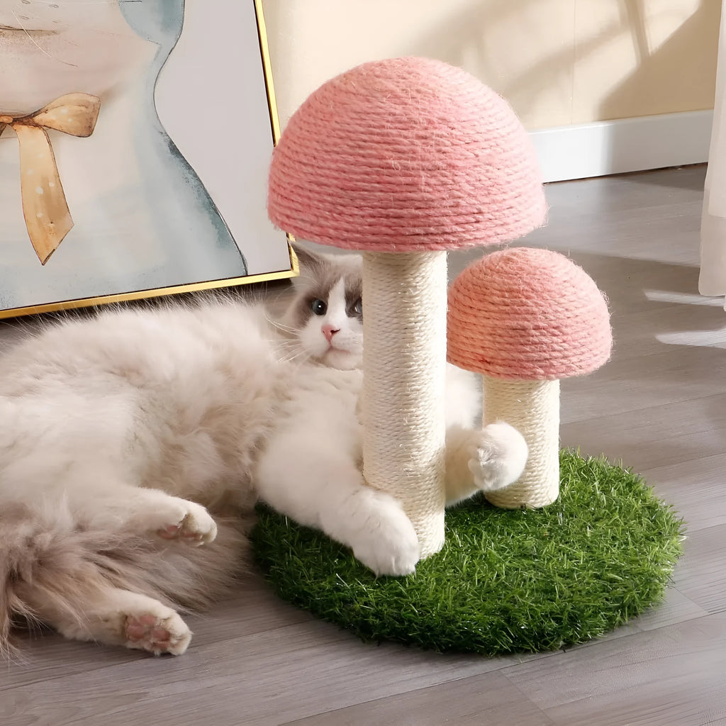 Pink mushroom-shaped cat scratching post with sisal-covered pole and caps on a sturdy base.