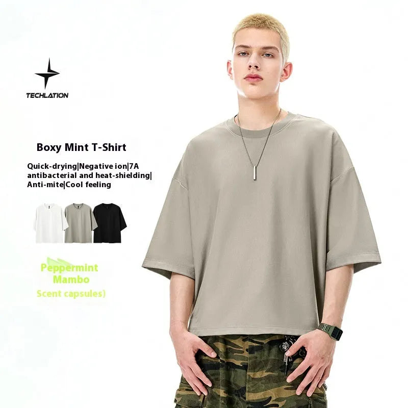 Men's sand grey loose fit short sleeve t-shirt showing cotton-polyester fabric texture