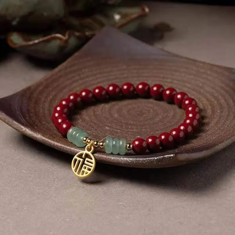 Handcrafted cinnabar bracelet with wave pattern design and copper bead accents in traditional Chinese style